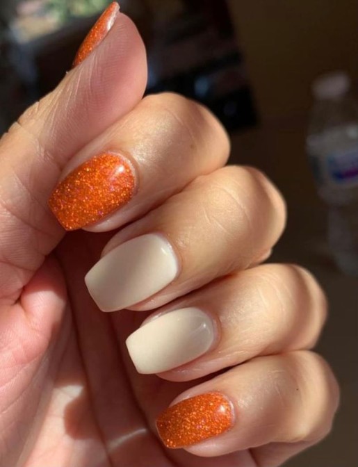 cute burnt orange nails with glitter