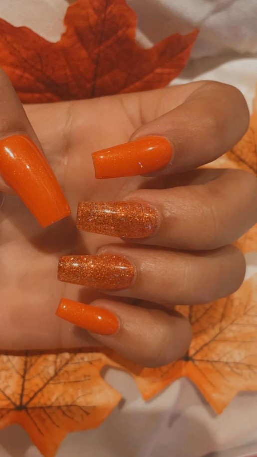 burnt orange nails with glitter