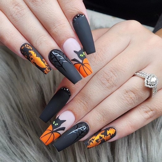 spooky Matte black Halloween nails with bats and pumpkins